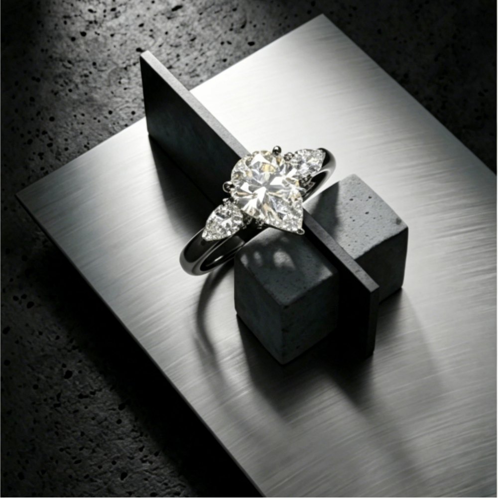 7x10mm pear-cut moissanite trinity three-stone ring — 2ct D-color VVS1, majestic design | TARA AYARH LUNE
